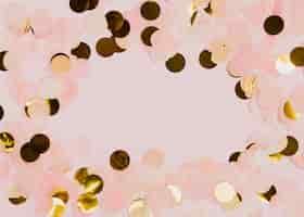 Free photo confetti at new years party with pink background