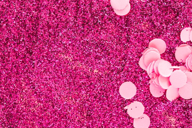 Free photo confetti on pink glitters