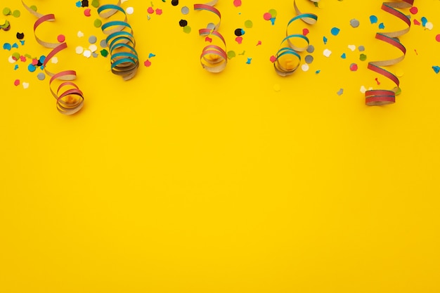 Free photo confetti on yellow