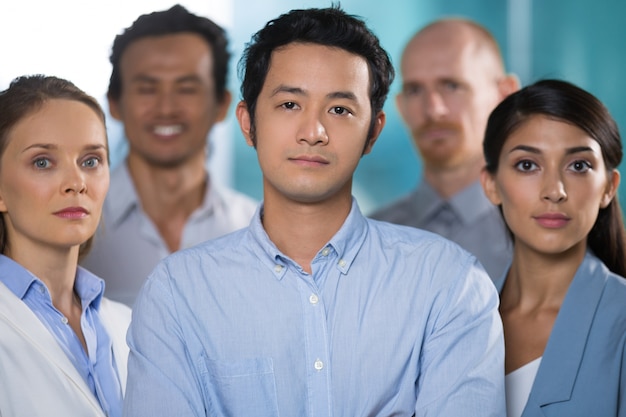 Free photo confident asian man working with strong team