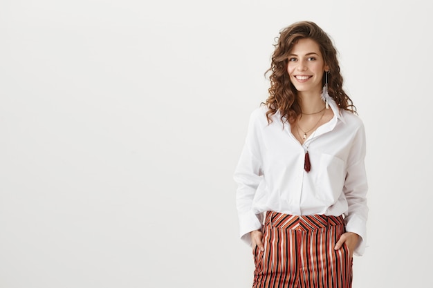 Confident attractive female entrepreneur smiling