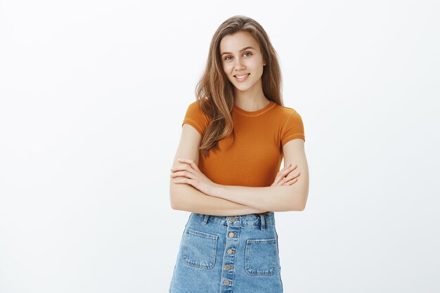 Confident attractive woman cross arms over chest and smiling