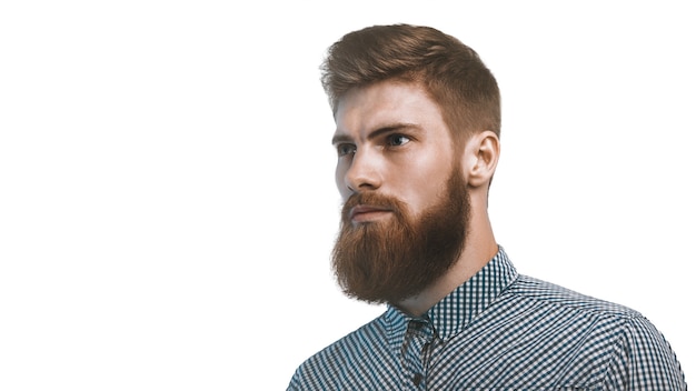 Confident bearded stylish man looking forward isolated on white background. copy space on left