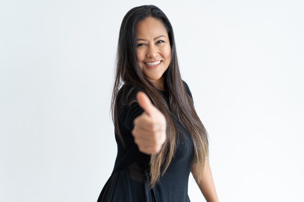 Confident beautiful middle-aged woman showing thumb up