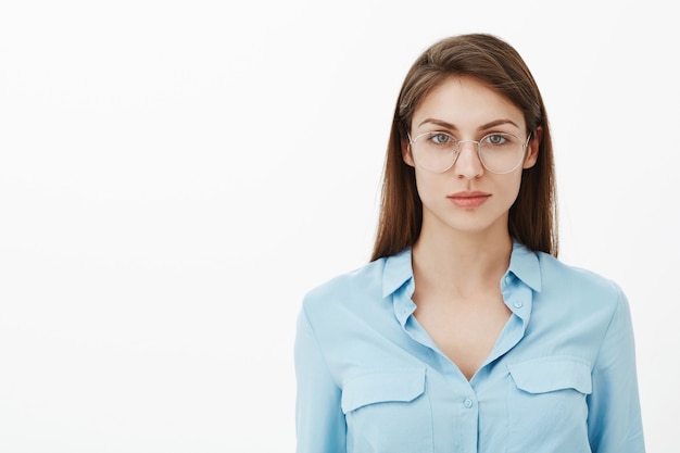 confident brunette businesswoman posing in the studio