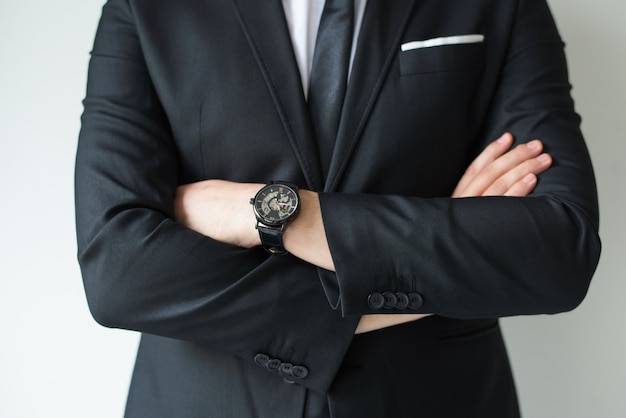 Confident businessman posing with arms crossed