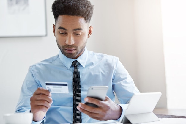 Confident businessman working at the desk