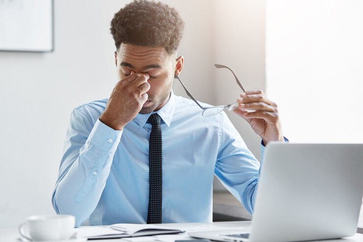Free Photo confident businessman working on his laptop