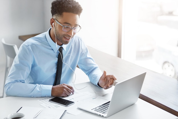 Confident businessman working on his laptop