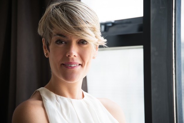 Confident businesswoman with modern hairstyle