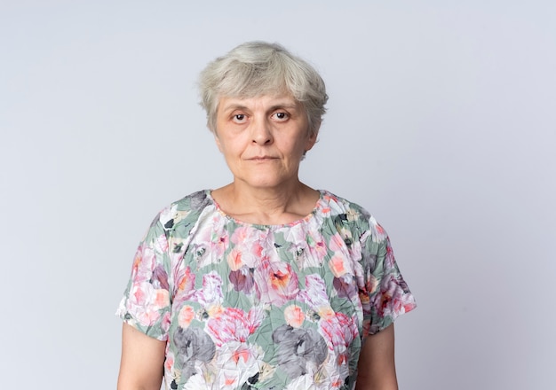 Free photo confident elderly woman stands isolated on white wall