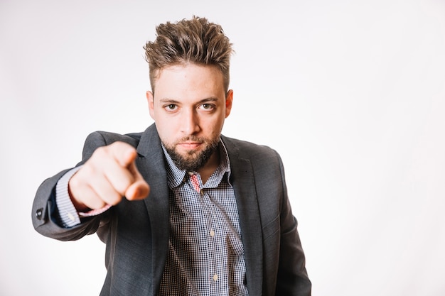 Confident employee pointing at camera