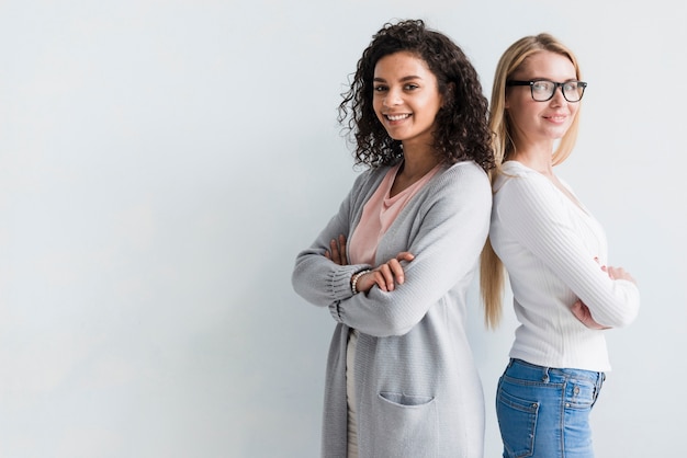 Free photo confident ethnic and blond female office workers team