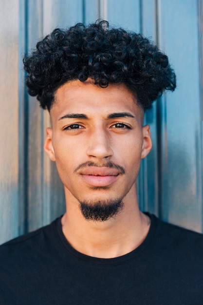 Confident ethnic man with curly hair 