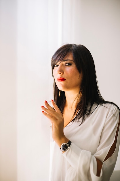 Free photo confident formal woman posing at camera