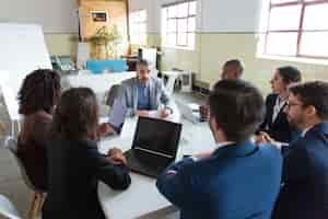 Free photo confident leader talking to subordinates