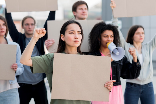 Confident people holding copy space cardboards