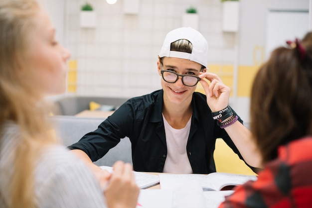 Confident student at table