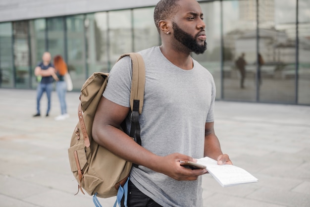 Confident student with documents