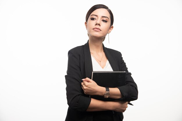 Confident woman posing with crossed arms. High quality photo