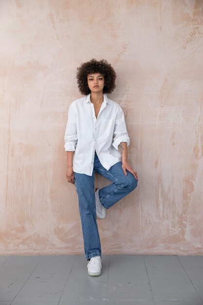 Confident woman with curly hair posing