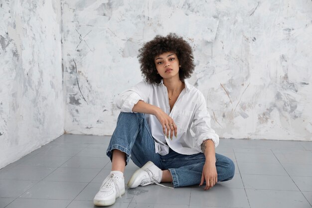 Confident woman with curly hair posing