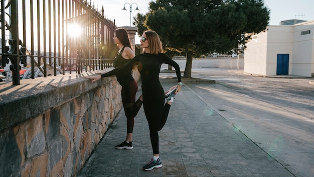 Confident women training together on street