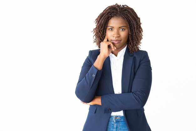 Confident young businesswoman looking at camera