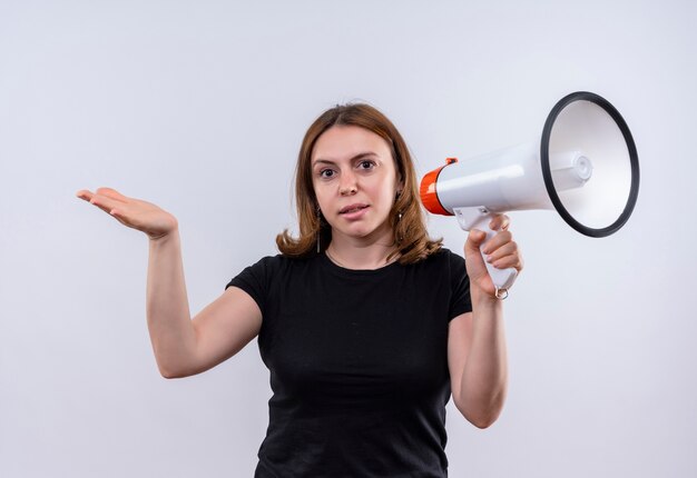 Confident young casual woman holding speaker and showing empty hand on isolated white space