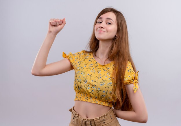Confident young girl with raised fist 