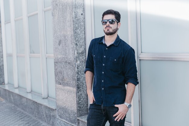 Confident young man posing on street