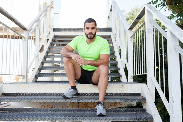 Confident young man training outdoors