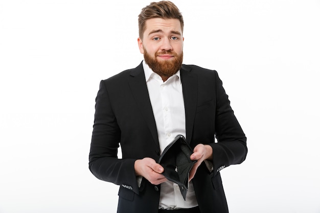 Confused bearded business man with empty purse