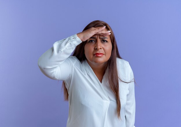 Confused casual caucasian middle-aged woman with hand 