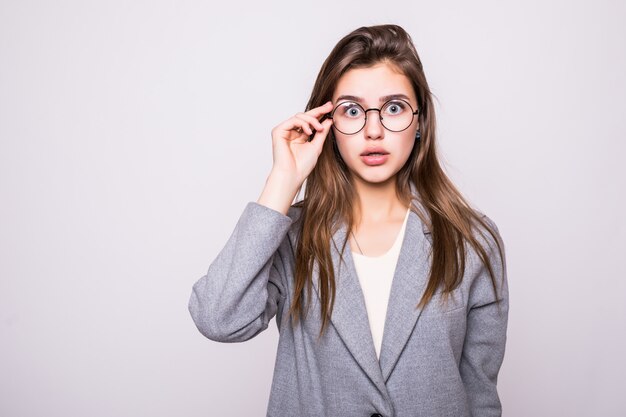 Confused woman puts her hands on the head, isolated on white background