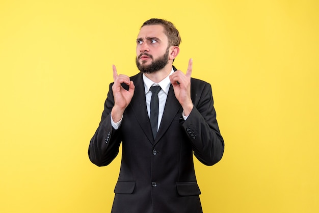 Confused young man trying to find solution over yellow