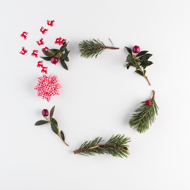 Coniferous branches, flowers and bow 