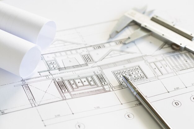 Construction plans and drawing tools on blueprints