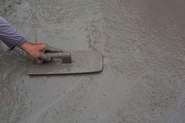 Construction technicians are mixing cement, stone, sand for construction.