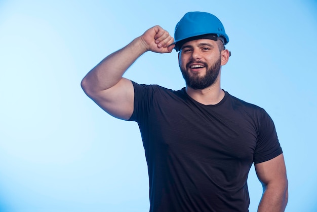 Free photo construction worker in blue helmet