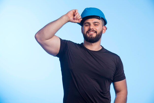 Construction worker in blue helmet . 