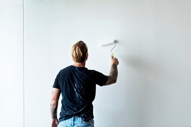 Construction worker painting the wall