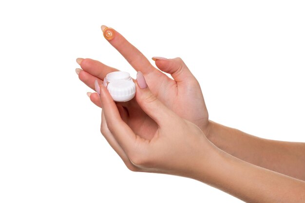 Contact eye lens. Close-up of woman hands holding white eyelense container. Woman fingers holding eye lense box. Health and eyes care concep