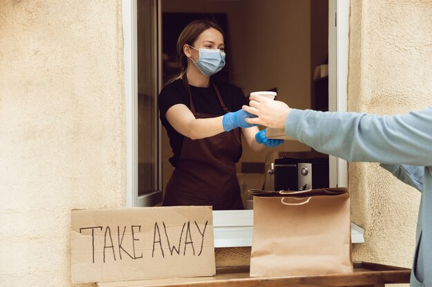 Contactless delivery service during quarantine coronavirus pandemic. Take away only concept.