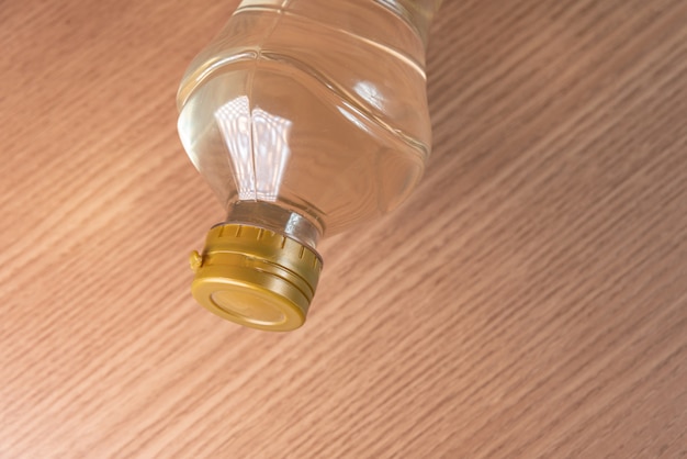 Free photo container of vinegar on the wooden background