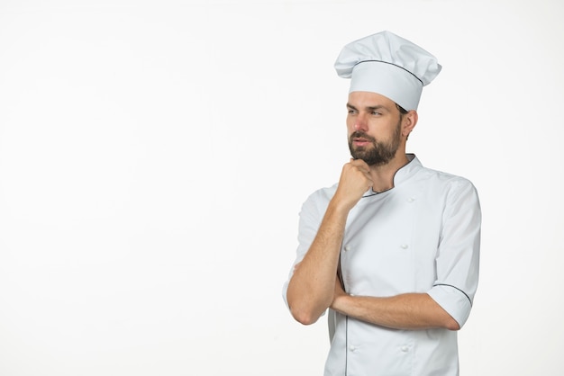 Free photo contemplated young male chef isolated on white background