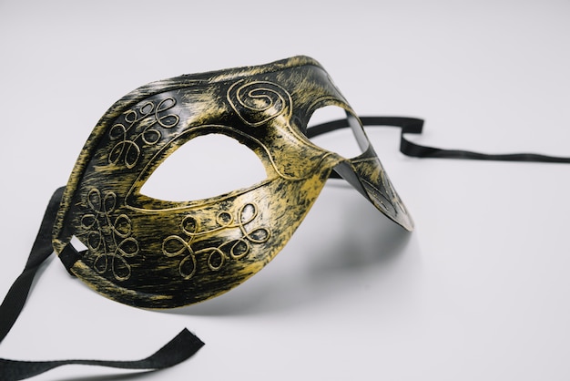 Contemporary shiny mask in golden strokes