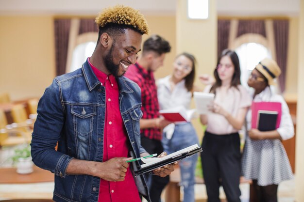 Content black man posing with book