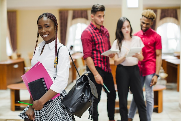 Content black student with notebooks