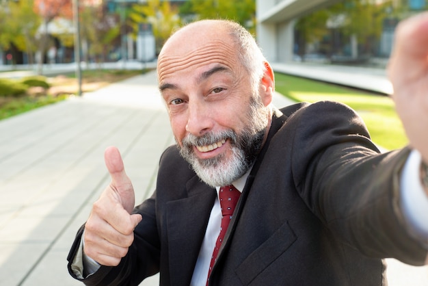 Free photo content businessman smiling